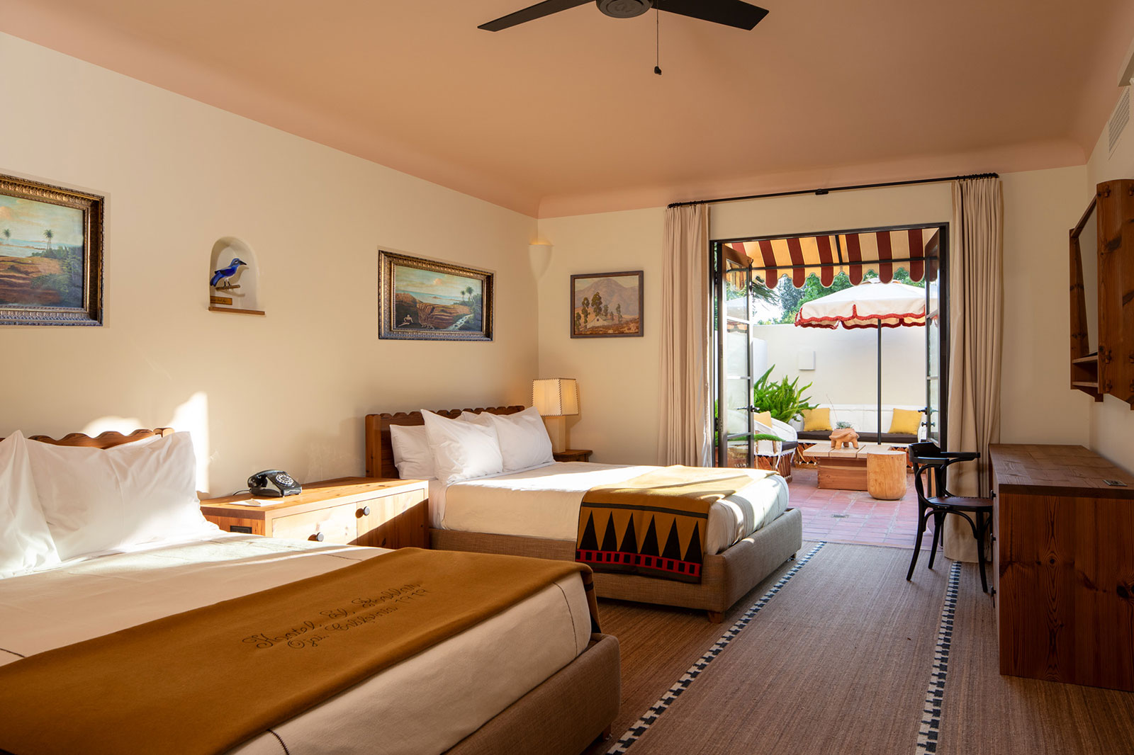 Two large beds in the Double Queen with Terrace with open doors to the terrace at Hotel El Roblar