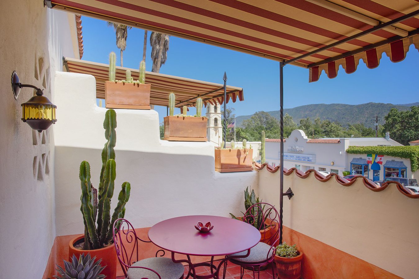 Hotel El Roblar room balcony with cactus and bistro table and chairs