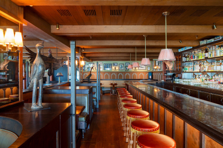Bar and row of leather stools in the Condor Bar at Hotel El Roblar